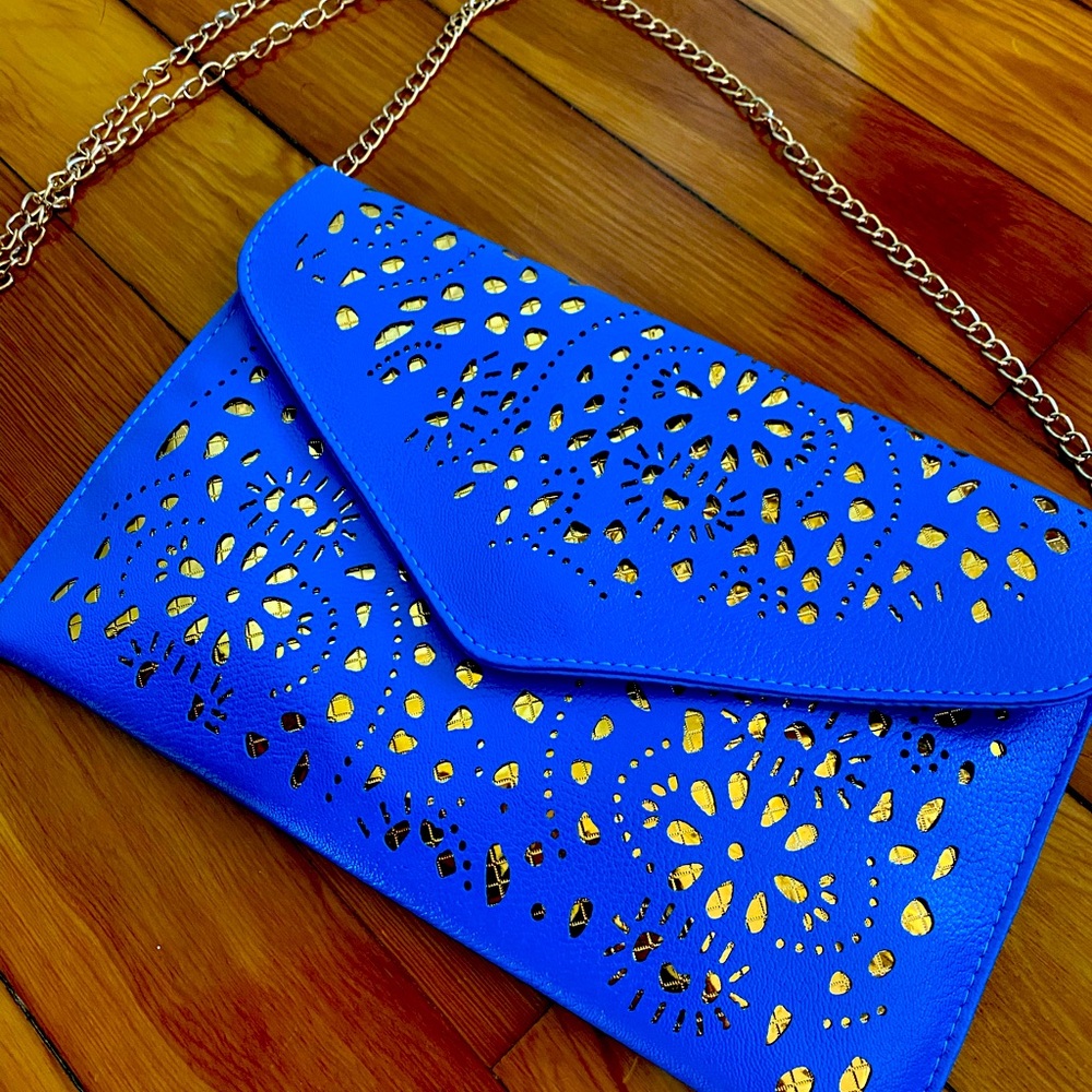 Cross Body. Bright Blue. Never used. Make an offer